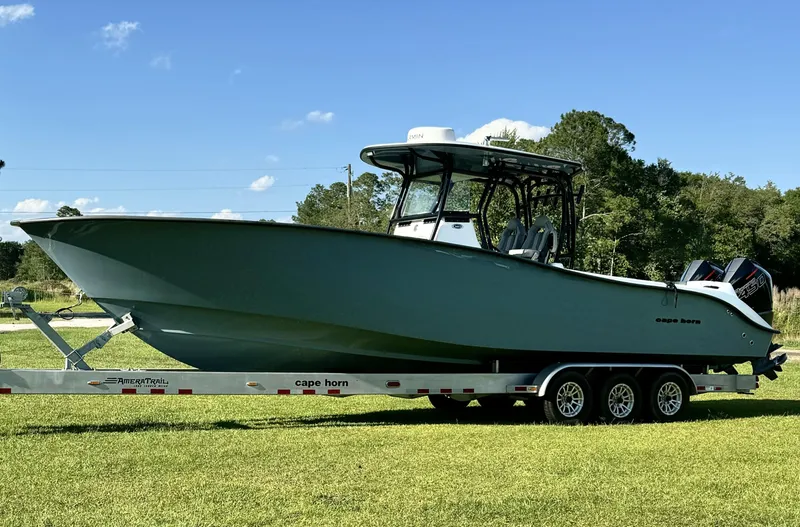  Yacht Photos Pics 2023 Cape Horn 34Xs boat on a trailer in a grassy area.