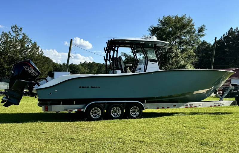  Yacht Photos Pics 2023 Cape Horn 34Xs boat on a trailer in a grassy area.
