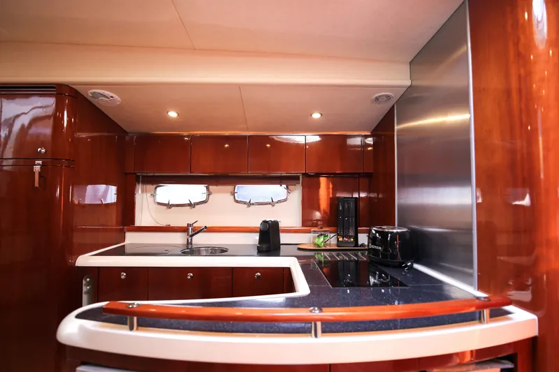  Yacht Photos Pics Luxurious kitchen interior of 2008 Fairline Targa 52 GT yacht with modern amenities.