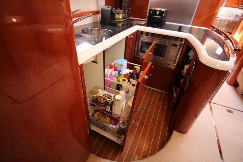  Yacht Photos Pics Luxurious 2008 Fairline Targa 52 GT yacht kitchen with modern amenities and sleek wood finish.