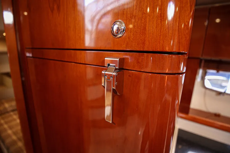  Yacht Photos Pics Polished wood cabinet with chrome latch on 2008 Fairline Targa 52 GT yacht interior.