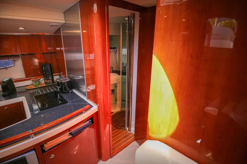  Yacht Photos Pics Interior of 2008 Fairline Targa 52 GT yacht with sleek kitchen and wooden finishes.