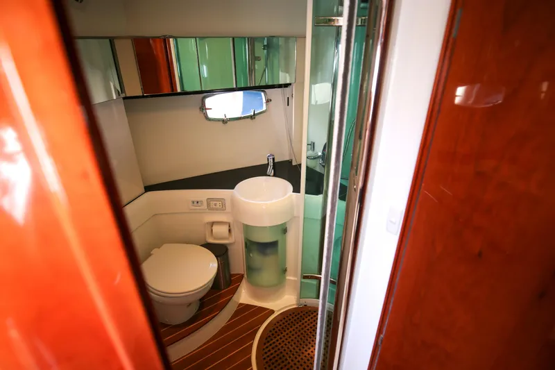  Yacht Photos Pics 2008 Fairline Targa 52 GT yacht bathroom with modern fixtures and wooden accents.