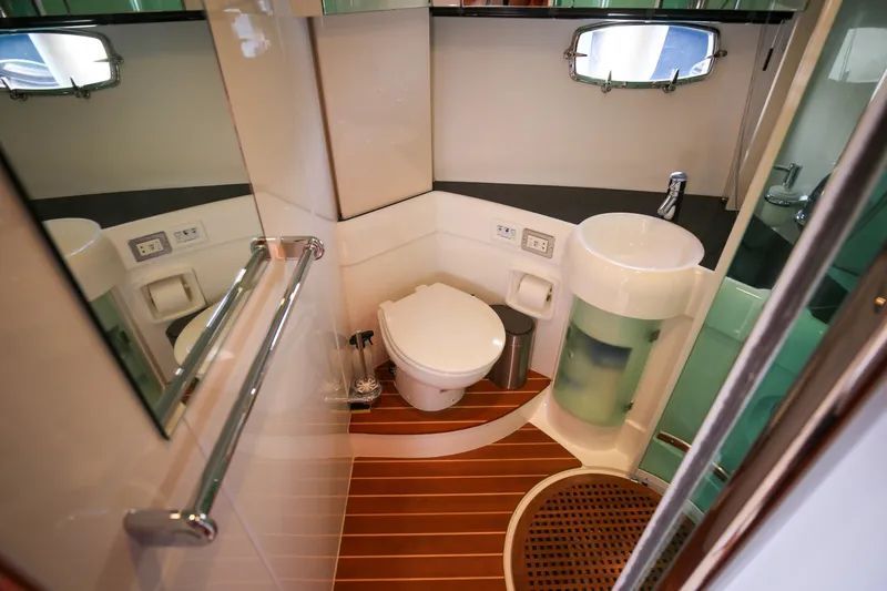  Yacht Photos Pics Luxurious 2008 Fairline Targa 52 GT yacht bathroom with modern fixtures and wooden flooring.