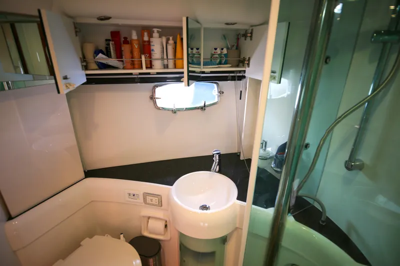  Yacht Photos Pics Bathroom interior of 2008 Fairline Targa 52 GT yacht with sink and shower.