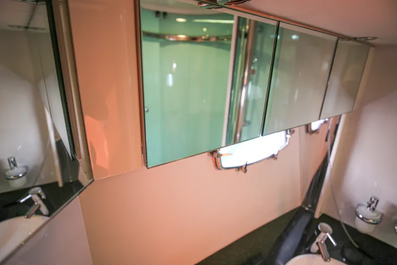  Yacht Photos Pics Luxurious bathroom interior of 2008 Fairline Targa 52 GT yacht, featuring mirrored cabinets.