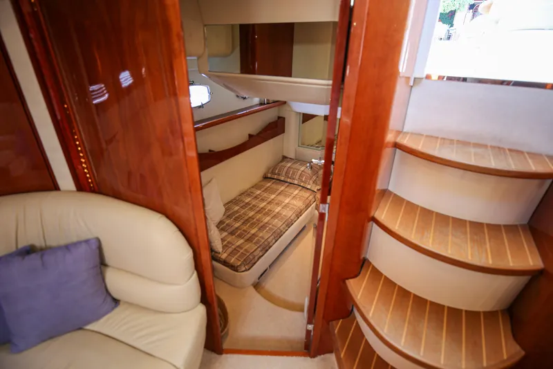  Yacht Photos Pics Luxurious interior of 2008 Fairline Targa 52 GT yacht with cozy cabin and elegant wood finishes.