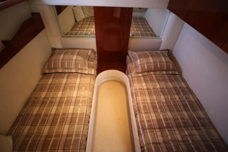  Yacht Photos Pics 2008 Fairline Targa 52 GT cabin with twin beds and plaid bedding.