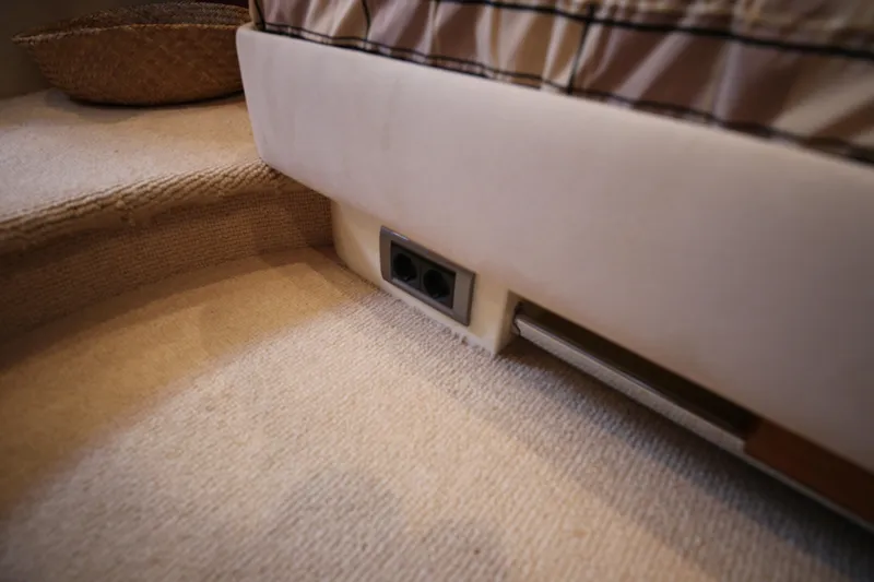  Yacht Photos Pics Interior of 2008 Fairline Targa 52 GT yacht, featuring carpeted flooring and electrical outlets.