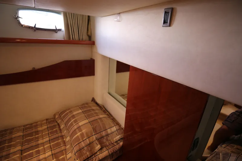  Yacht Photos Pics 2008 Fairline Targa 52 GT cabin interior with bed and window view.