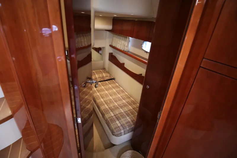  Yacht Photos Pics Luxurious cabin interior of 2008 Fairline Targa 52 GT yacht with wood finish.