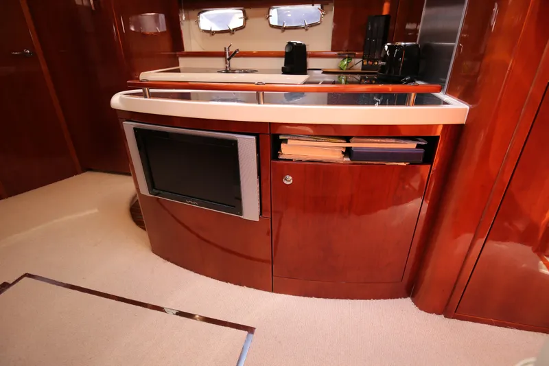  Yacht Photos Pics Luxurious 2008 Fairline Targa 52 GT yacht interior with sleek wooden cabinetry and modern amenities.