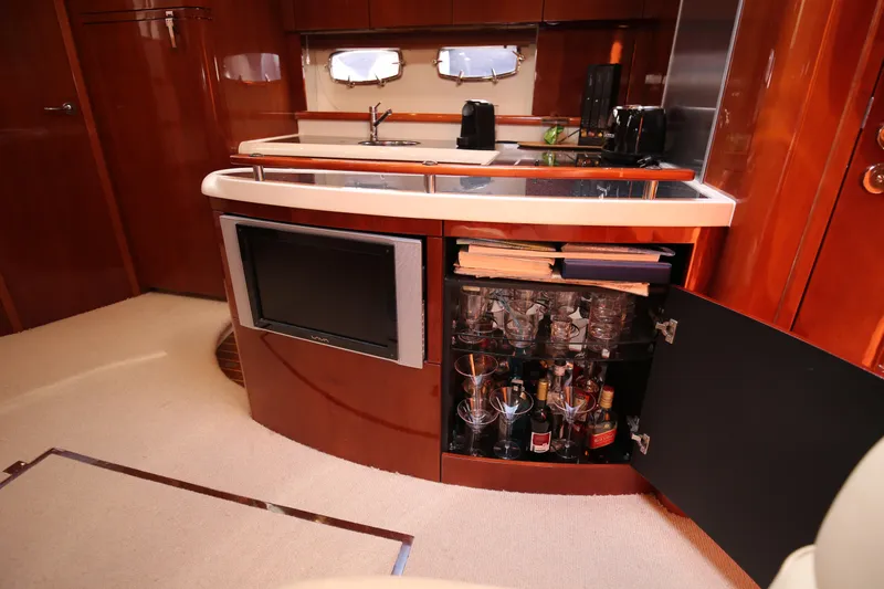  Yacht Photos Pics Luxurious 2008 Fairline Targa 52 GT yacht interior with bar and entertainment area.