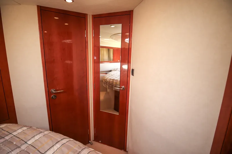  Yacht Photos Pics Interior of 2008 Fairline Targa 52 GT yacht with wooden doors and mirrored panel.