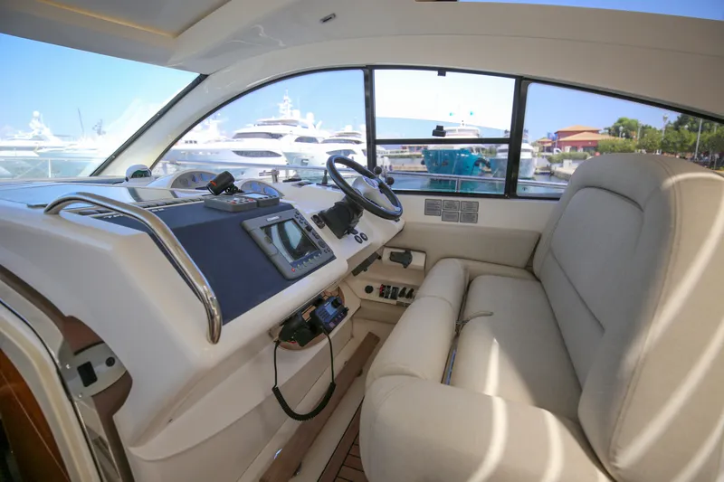  Yacht Photos Pics Interior of 2008 Fairline Targa 52 GT yacht with helm and seating area.