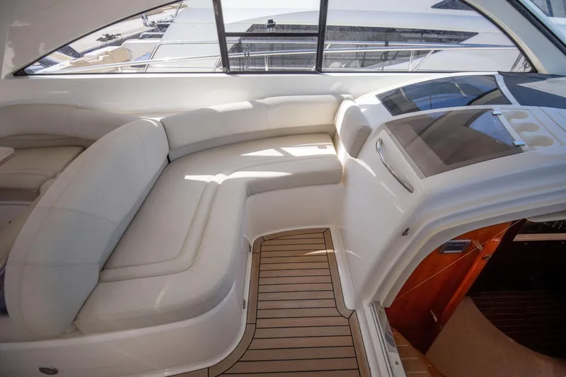  Yacht Photos Pics Luxurious interior of 2008 Fairline Targa 52 GT yacht with elegant seating and wood flooring.