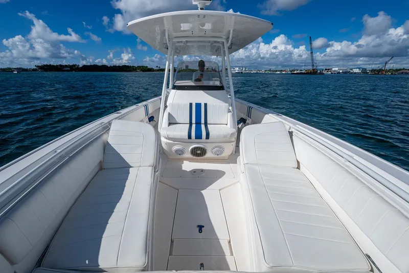 Match Point Yacht Photos Pics 2011 Intrepid 327 Center Console boat on water, featuring spacious seating and clear skies.