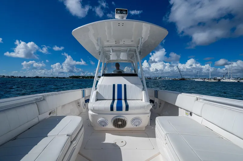 Match Point Yacht Photos Pics 2011 Intrepid 327 Center Console boat on open water under blue sky.