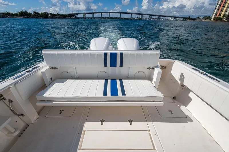 Match Point Yacht Photos Pics 2011 Intrepid 327 Center Console boat with white seating, cruising on open water.