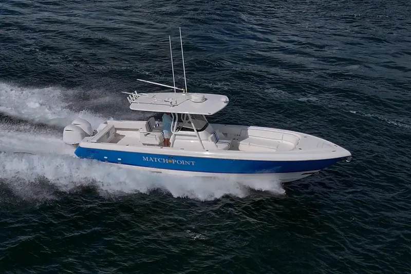 Match Point Yacht Photos Pics 2011 Intrepid 327 Center Console boat cruising on open water.