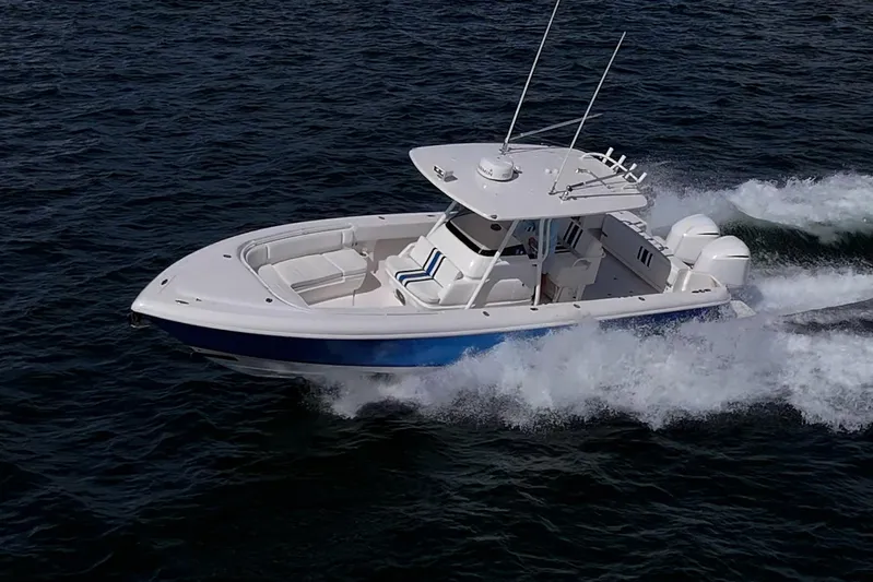 Match Point Yacht Photos Pics 2011 Intrepid 327 Center Console boat cruising on open water.