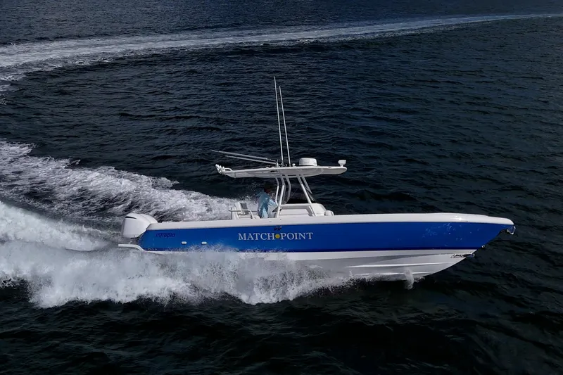Match Point Yacht Photos Pics 2011 Intrepid 327 Center Console boat cruising on open water.