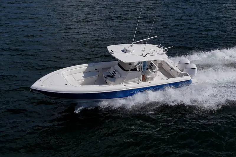 Match Point Yacht Photos Pics 2011 Intrepid 327 Center Console boat cruising on open water.