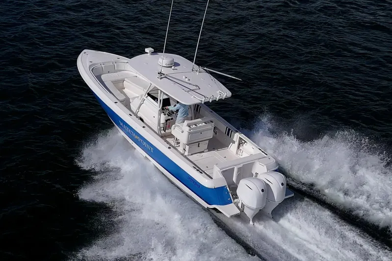 Match Point Yacht Photos Pics 2011 Intrepid 327 Center Console boat cruising on open water.
