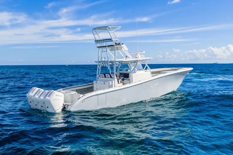  Yacht Photos Pics 2015 Yellowfin 42 Offshore boat on open ocean under clear blue sky.