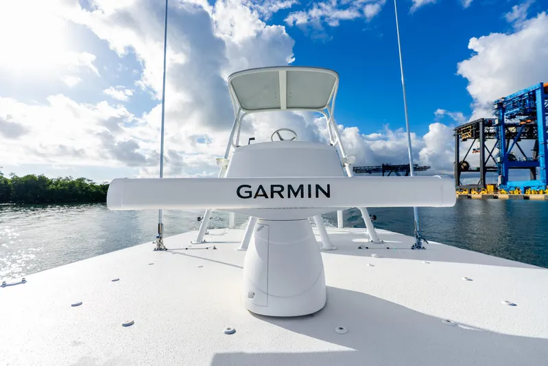  Yacht Photos Pics 2015 Yellowfin 42 Offshore boat with Garmin radar, under a bright blue sky.