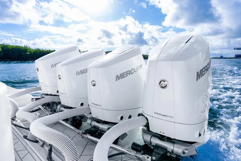  Yacht Photos Pics Four Mercury Verado engines on a 2015 Yellowfin 42 Offshore boat in open water.