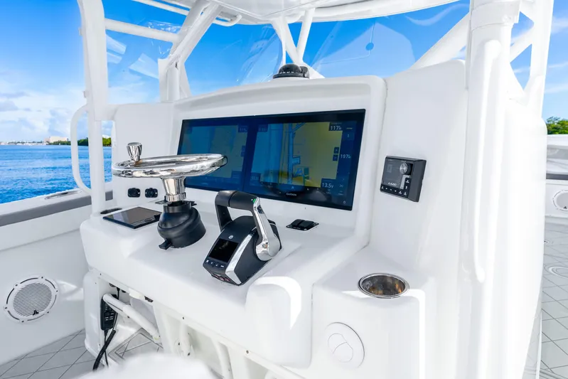  Yacht Photos Pics 2015 Yellowfin 42 Offshore boat helm with advanced navigation system and controls.