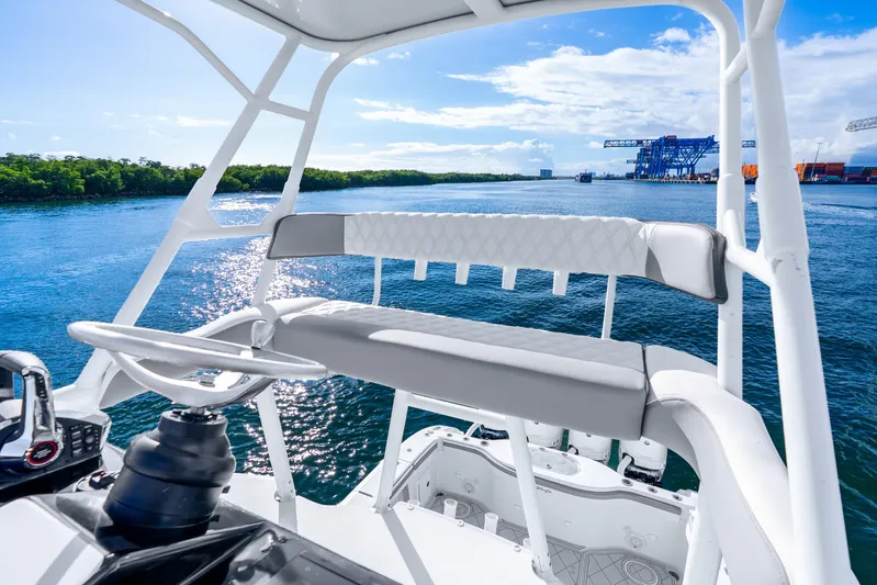  Yacht Photos Pics 2015 Yellowfin 42 Offshore boat helm with scenic waterway view.