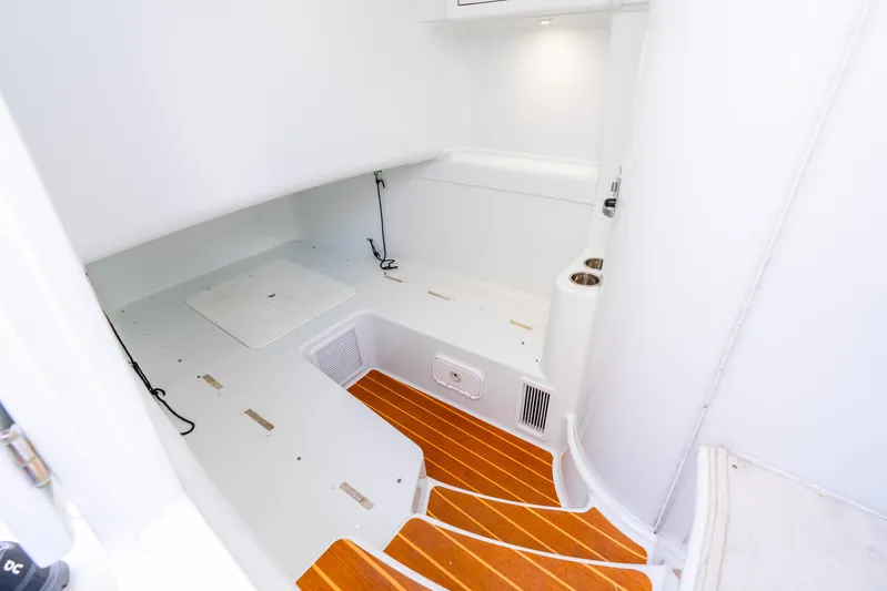  Yacht Photos Pics 2015 Yellowfin 42 Offshore interior with white walls and wooden flooring.