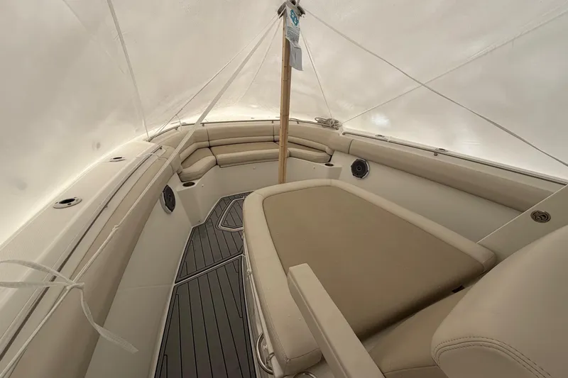  Yacht Photos Pics 2018 Boston Whaler 330 Outrage interior with beige seating and sleek design.