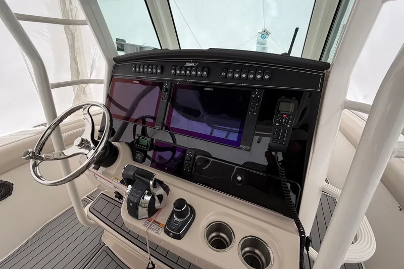  Yacht Photos Pics 2018 Boston Whaler 330 Outrage helm with advanced navigation and control systems.