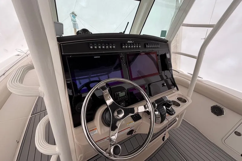  Yacht Photos Pics 2018 Boston Whaler 330 Outrage helm with advanced navigation and control systems.