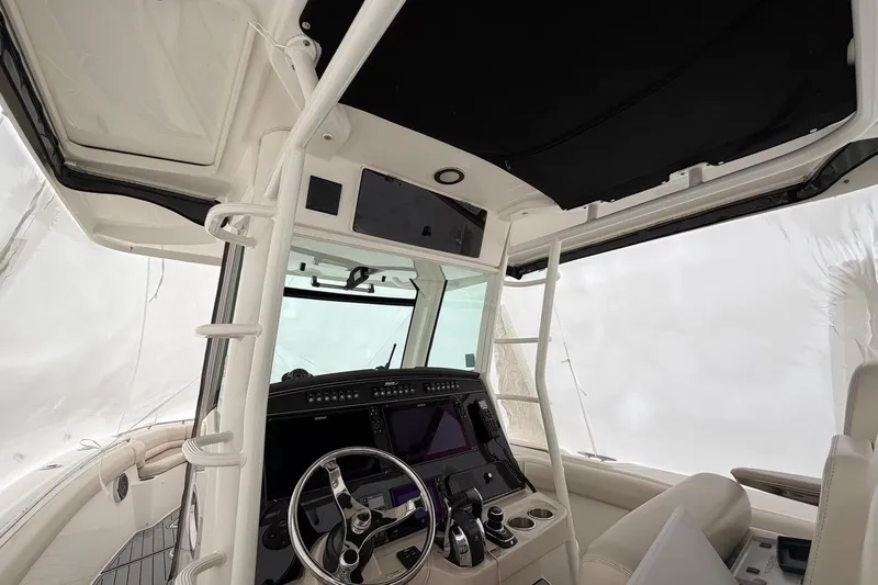  Yacht Photos Pics 2018 Boston Whaler 330 Outrage helm with modern controls and sleek design.