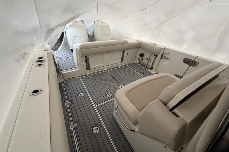  Yacht Photos Pics 2018 Boston Whaler 330 Outrage interior with seating and deck details.