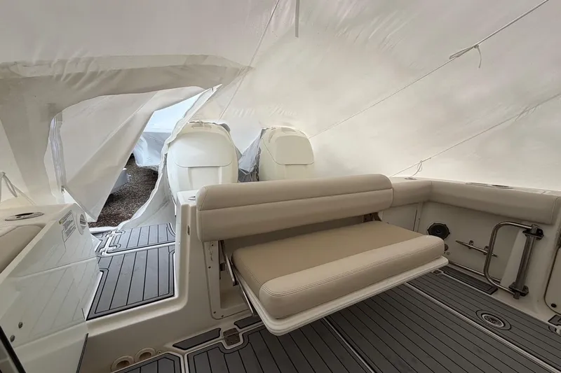  Yacht Photos Pics 2018 Boston Whaler 330 Outrage interior with seating and covered deck.