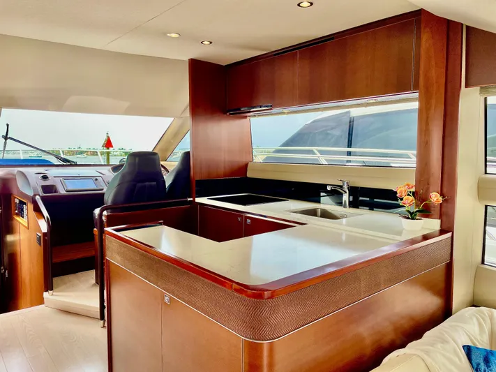  Yacht Photos Pics Luxurious 2015 Princess f56 yacht interior with modern kitchen and helm station.