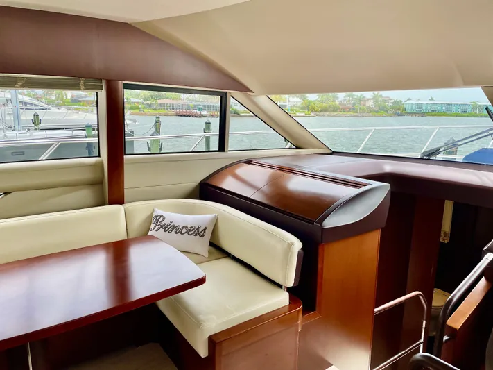  Yacht Photos Pics Luxurious interior of 2015 Princess f56 yacht with elegant seating and wooden finishes.