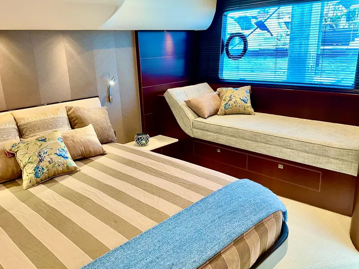  Yacht Photos Pics Luxurious 2015 Princess f56 yacht bedroom with striped bedding and elegant decor.