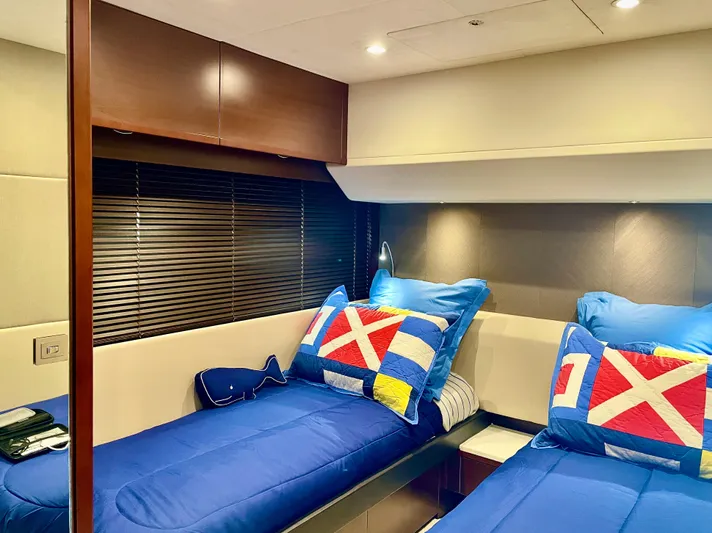  Yacht Photos Pics Luxurious 2015 Princess f56 yacht cabin with twin beds and nautical-themed decor.