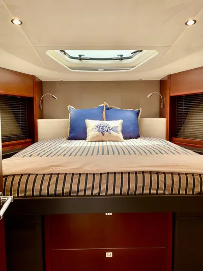  Yacht Photos Pics Luxurious cabin interior of 2015 Princess f56 yacht with skylight and elegant bedding.
