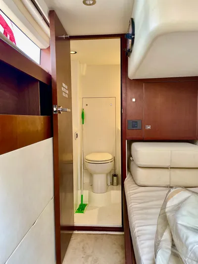  Yacht Photos Pics Interior of 2015 Princess f56 yacht showing bathroom and seating area.