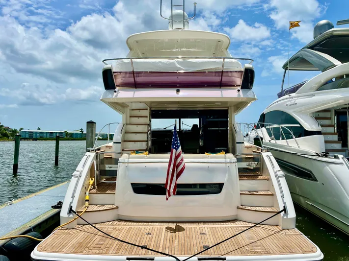  Yacht Photos Pics Luxury Princess f56 yacht docked, rear view with American flag, sunny day, 2015 model.