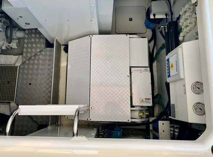  Yacht Photos Pics Engine compartment of a 2015 Princess f56 yacht, featuring mechanical components and control panels.