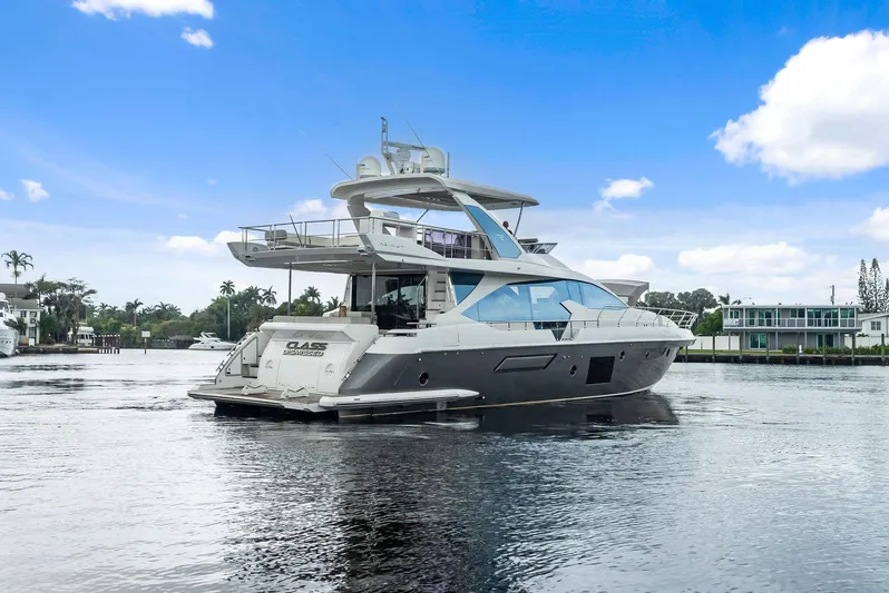 Class Dismissed Yacht Photos Pics Azimut 72 Flybridge 2017 yacht on calm water under a clear blue sky.