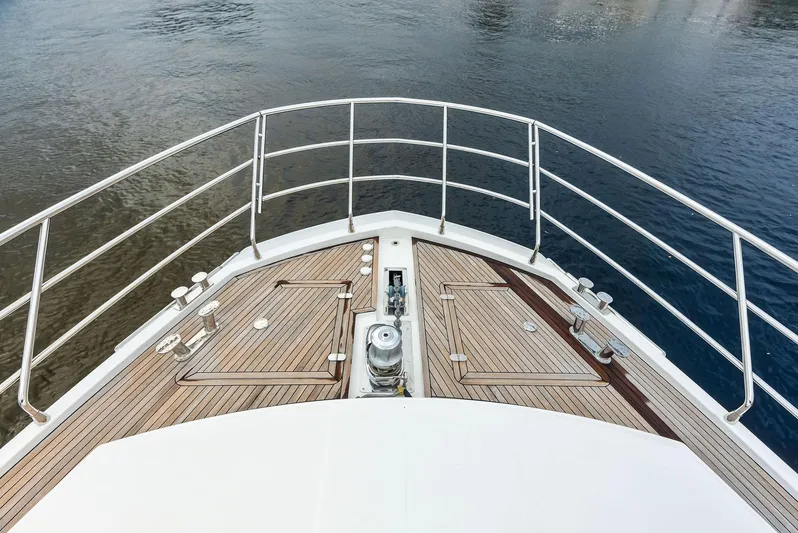 Class Dismissed Yacht Photos Pics Bow view of 2017 Azimut 72 Flybridge yacht on calm water.